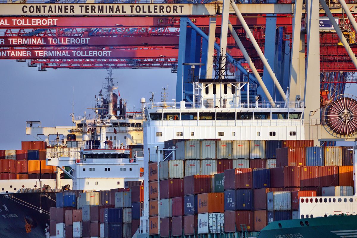 Container ships at a global port at sunset